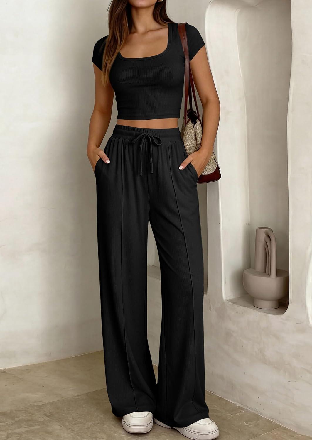 imagePRETTYGARDEN Womens 2 Piece Matching Lounge Sets Ribbed Short Sleeve Crop Tops Wide Leg Pants 2026 Summer Airport OutfitsBlack