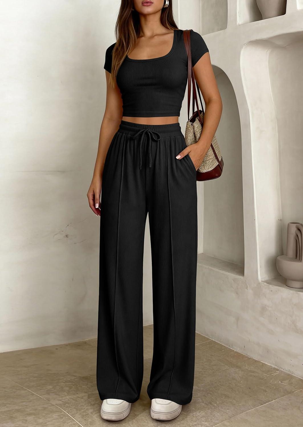 imagePRETTYGARDEN Womens 2 Piece Matching Lounge Sets Ribbed Short Sleeve Crop Tops Wide Leg Pants 2026 Summer Airport OutfitsBlack