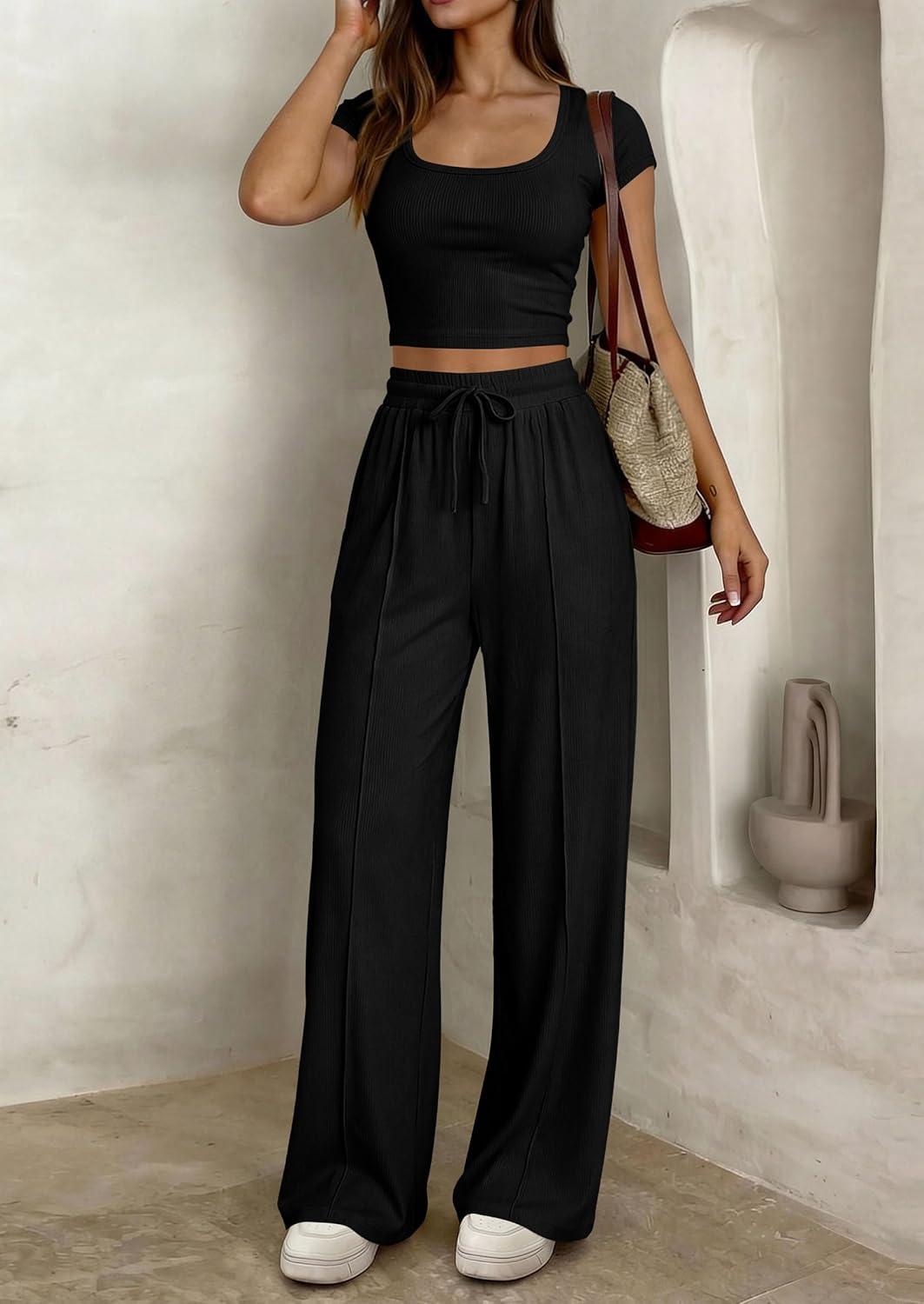 imagePRETTYGARDEN Womens 2 Piece Matching Lounge Sets Ribbed Short Sleeve Crop Tops Wide Leg Pants 2026 Summer Airport OutfitsBlack