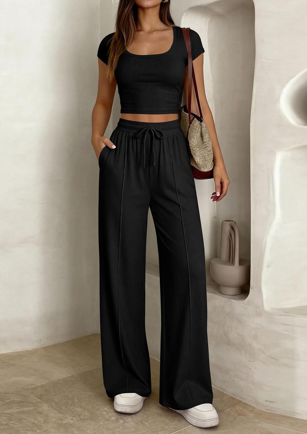 imagePRETTYGARDEN Womens 2 Piece Matching Lounge Sets Ribbed Short Sleeve Crop Tops Wide Leg Pants 2026 Summer Airport OutfitsBlack