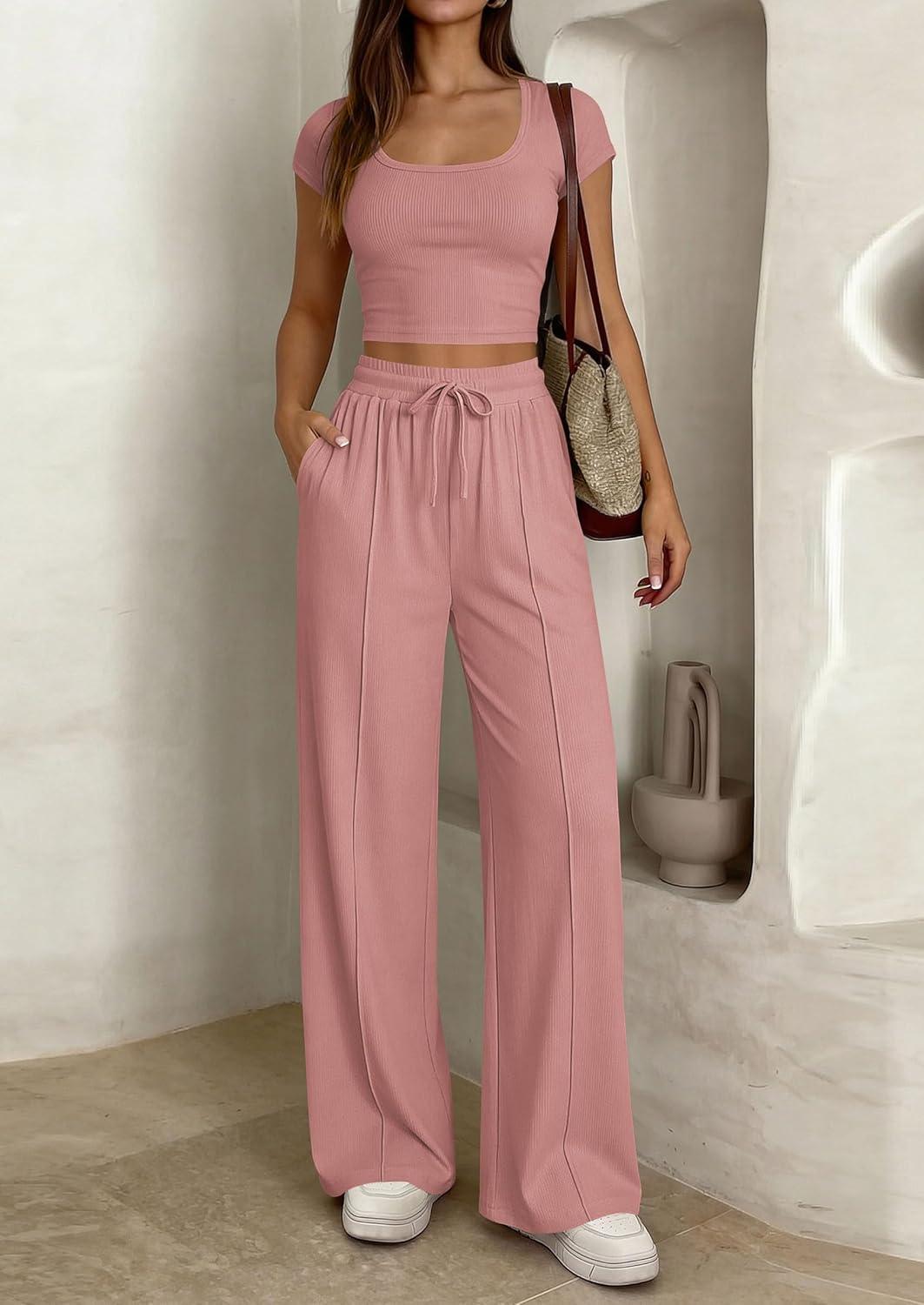 imagePRETTYGARDEN Womens 2 Piece Matching Lounge Sets Ribbed Short Sleeve Crop Tops Wide Leg Pants 2026 Summer Airport OutfitsPink